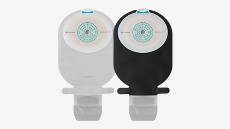 Black SenSura Mio bag is showcased next to the original grey SenSura Mio ostomy bag